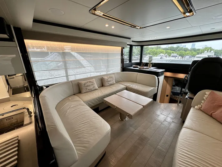 Just You Yacht Photos Pics Luxurious interior of 2023 Absolute 52 Navetta yacht with elegant seating and modern design.