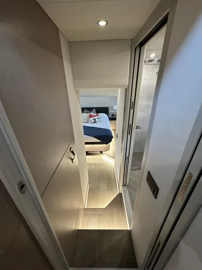 Just You Yacht Photos Pics Interior hallway of 2023 Absolute 52 Navetta yacht leading to a bedroom.
