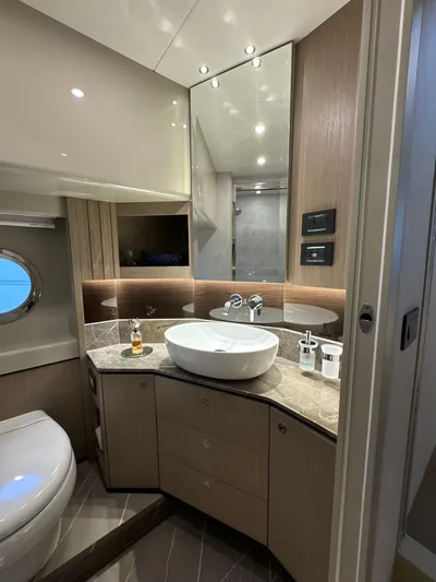 Just You Yacht Photos Pics Luxurious bathroom in 2023 Absolute 52 Navetta yacht with modern fixtures and elegant design.