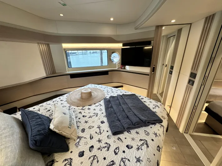 Just You Yacht Photos Pics Luxurious bedroom interior of 2023 Absolute 52 Navetta yacht with nautical decor.