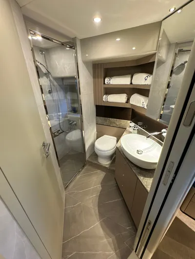 Just You Yacht Photos Pics Luxurious bathroom in 2023 Absolute 52 Navetta yacht with modern fixtures and elegant design.