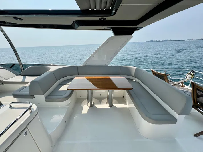 Just You Yacht Photos Pics Luxurious seating area on 2023 Absolute 52 Navetta yacht with ocean view.