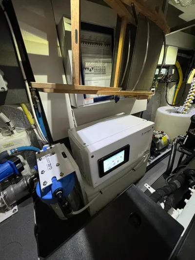 Just You Yacht Photos Pics Engine room of 2023 Absolute 52 Navetta yacht with advanced equipment and control systems.