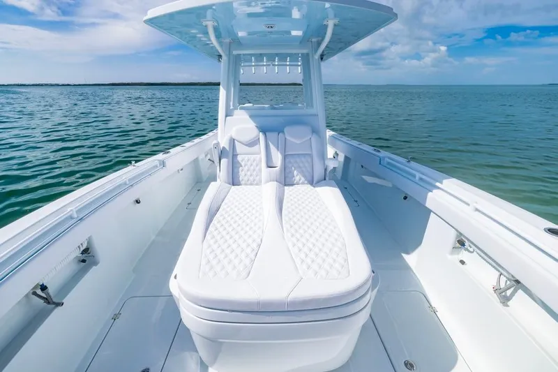  Yacht Photos Pics 2026 Invincible 33 Catamaran with luxurious seating on open water.