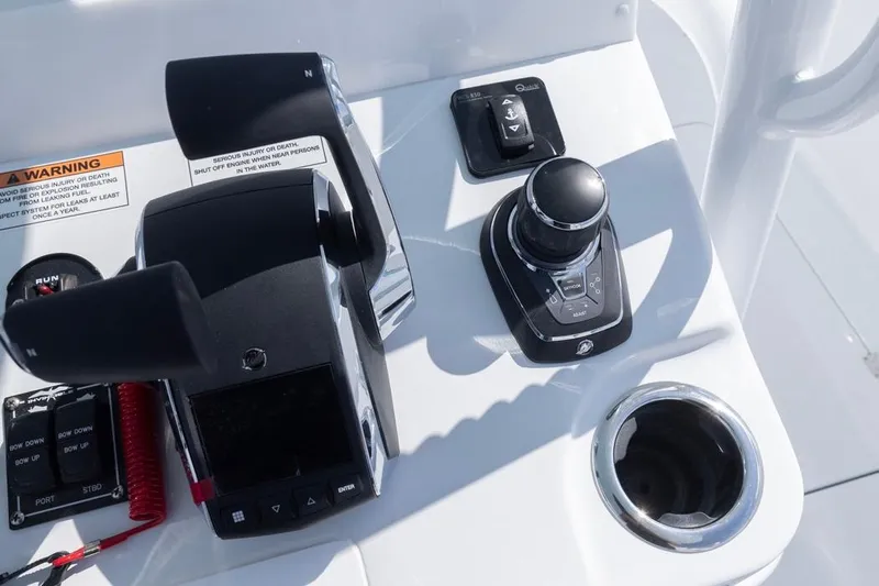  Yacht Photos Pics Control panel of 2026 Invincible 33 Catamaran with joystick and throttle controls.