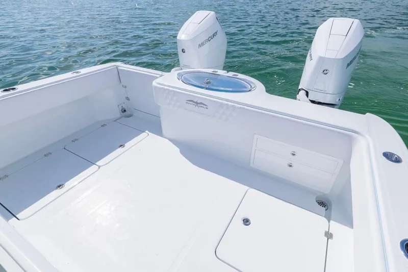  Yacht Photos Pics 2026 Invincible 33 Catamaran with dual Mercury engines on calm water.