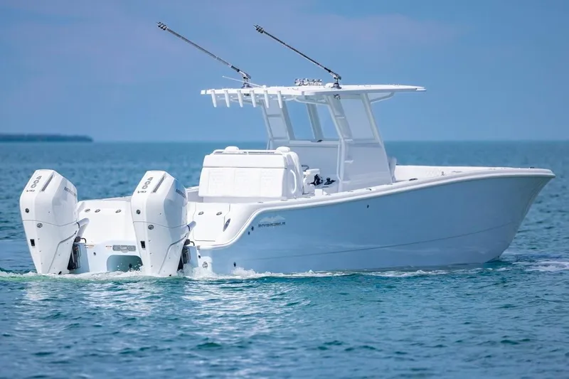  Yacht Photos Pics 2026 Invincible 33 Catamaran cruising on open water, showcasing sleek design and powerful engines.