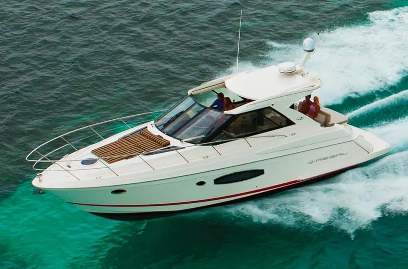 Sea Wolf Yacht Photos Pics Manufacturer Provided Image: 2013 Regal 42 Sport Coupe cruising on clear blue water.