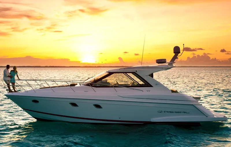 Sea Wolf Yacht Photos Pics Manufacturer Provided Image: 2013 Regal 42 Sport Coupe yacht at sunset on the ocean.