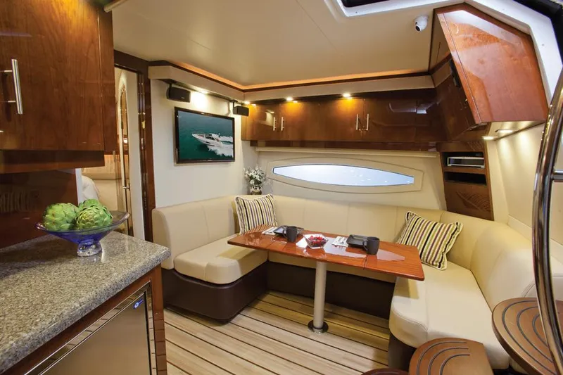  Yacht Photos Pics Manufacturer Provided Image: Luxurious interior of 2015 Regal 42 Sport Coupe yacht with modern seating and dining area.
