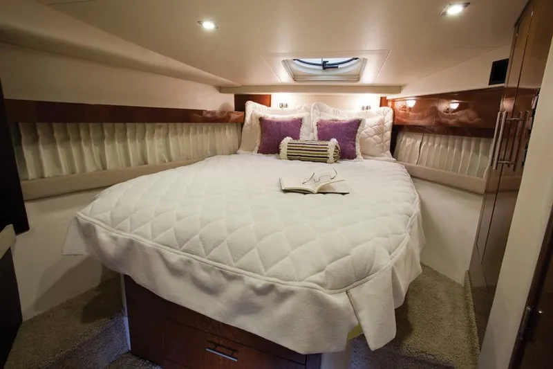  Yacht Photos Pics Manufacturer Provided Image: Luxurious bedroom in 2015 Regal 42 Sport Coupe yacht with cozy bedding and elegant decor.