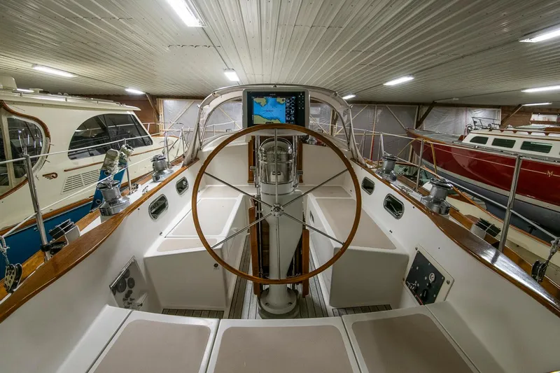 Hera Yacht Photos Pics Hinckley Sou'wester 42 Sloop 1994, interior view, wooden steering wheel, stored indoors.