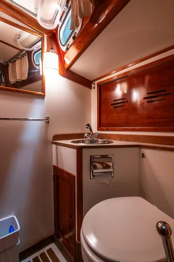 Hera Yacht Photos Pics Luxurious 1994 Hinckley Sou'wester 42 Sloop bathroom with wood accents and modern fixtures.