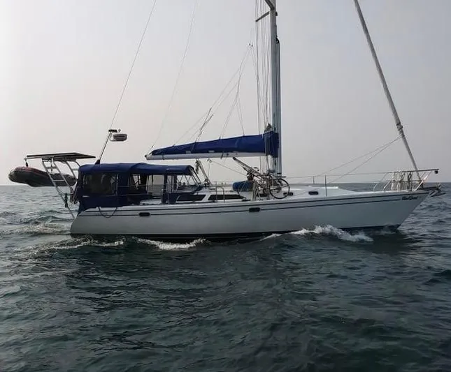 Windquest Yacht Photos Pics 2001 Catalina 42 MkII sailboat cruising on open water, side view.