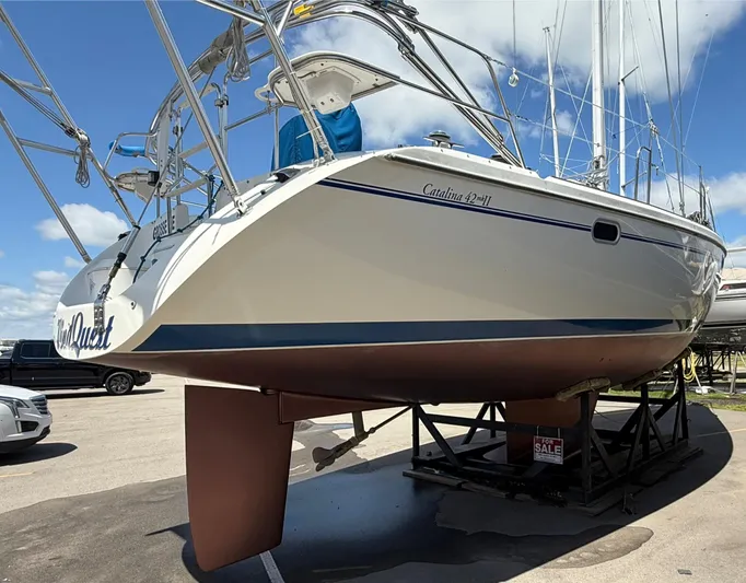 Windquest Yacht Photos Pics 2001 Catalina 42 MkII sailboat on display, elevated on a stand, with a "For Sale" sign.