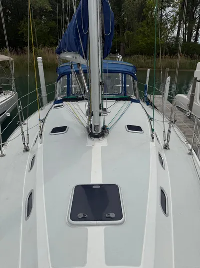 Windquest Yacht Photos Pics 2001 Catalina 42 MkII sailboat deck with blue sail cover, docked in a marina.