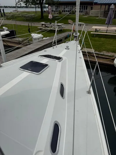 Windquest Yacht Photos Pics 2001 Catalina 42 MkII sailboat docked, showcasing sleek deck design and mooring area.