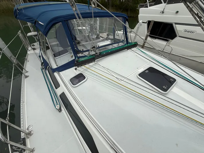 Windquest Yacht Photos Pics 2001 Catalina 42 MkII sailboat with blue canopy and deck details.
