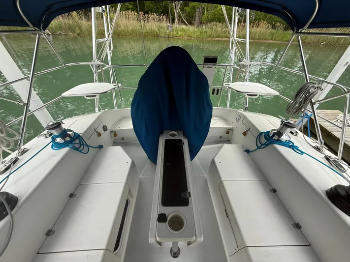 Windquest Yacht Photos Pics Cockpit of 2001 Catalina 42 MkII sailboat with blue cover and seating.
