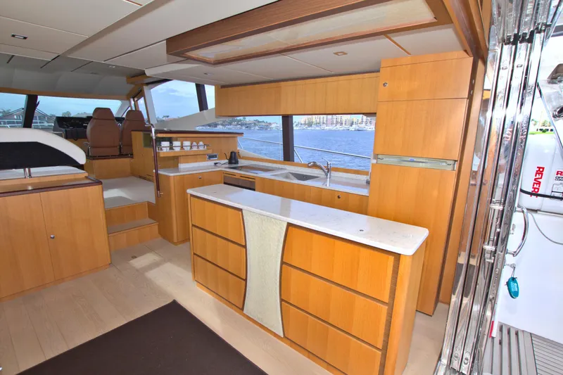 Wanderlust Yacht Photos Pics Luxurious 2015 Dyna 60 yacht interior with modern kitchen and scenic ocean view.