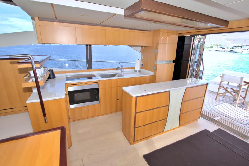 Wanderlust Yacht Photos Pics Luxurious kitchen interior on 2015 Dyna 60 yacht with ocean view.