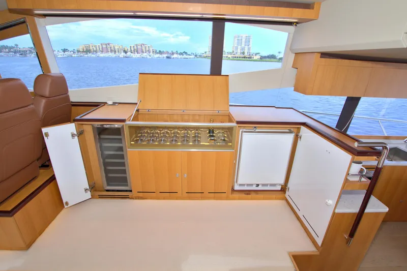 Wanderlust Yacht Photos Pics Luxurious interior of 2015 Dyna 60 yacht with modern kitchen and ocean view.
