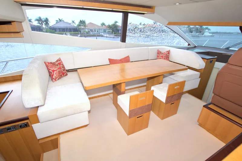 Wanderlust Yacht Photos Pics Luxurious interior of 2015 Dyna 60 yacht with elegant seating and scenic window view.