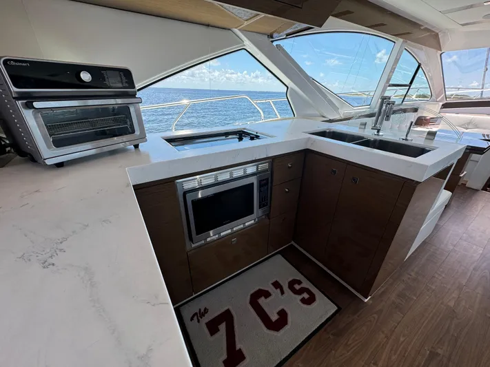 The 7 C's Yacht Photos Pics Modern kitchen in 2021 Cruisers Yachts 60 Cantius Flybridge with ocean view.
