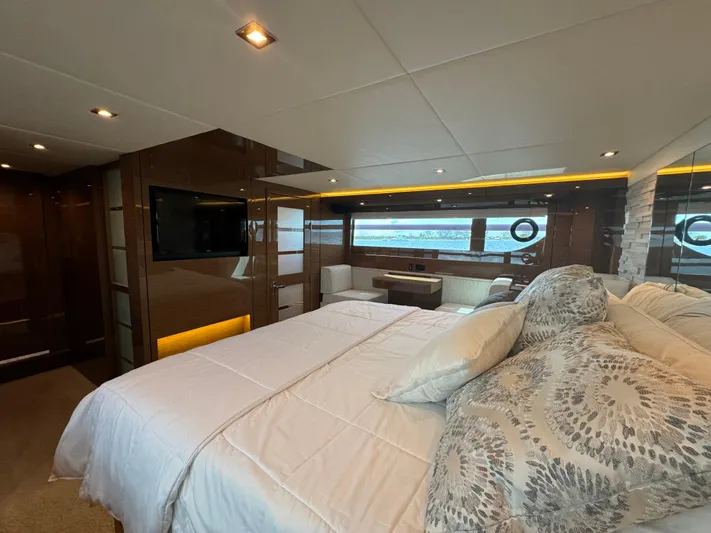 The 7 C's Yacht Photos Pics Luxurious bedroom interior of 2021 Cruisers Yachts 60 Cantius Flybridge with modern amenities.