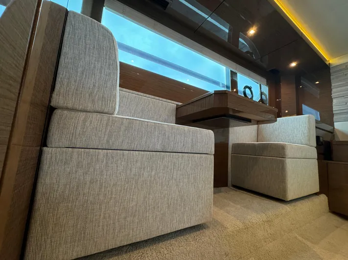 The 7 C's Yacht Photos Pics Luxurious interior of 2021 Cruisers Yachts 60 Cantius Flybridge with plush seating.