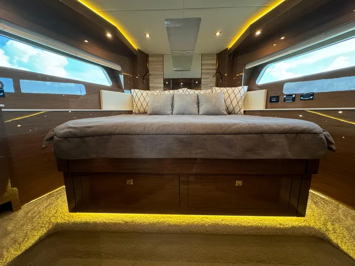 The 7 C's Yacht Photos Pics Luxurious bedroom interior of 2021 Cruisers Yachts 60 Cantius Flybridge with modern design.