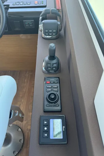 The 7 C's Yacht Photos Pics Control panel of 2021 Cruisers Yachts 60 Cantius Flybridge with joystick and digital display.