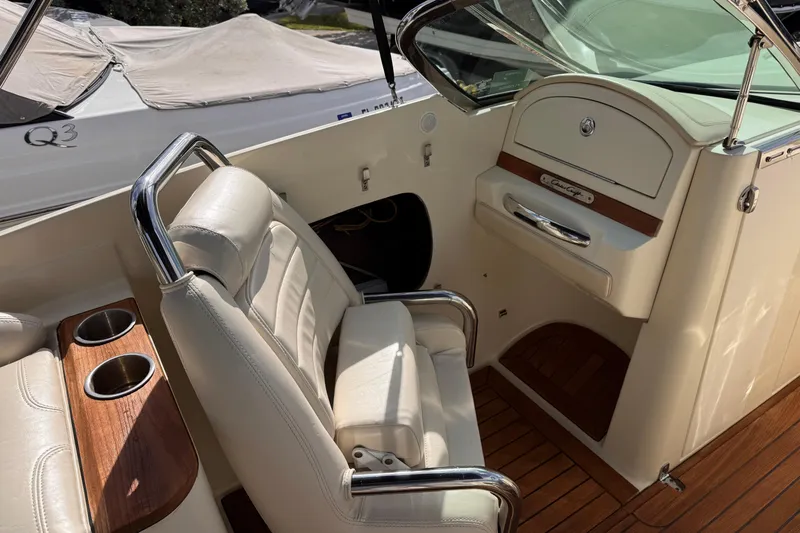  Yacht Photos Pics 2014 Chris-Craft Launch 28 interior with leather seats and wooden accents.