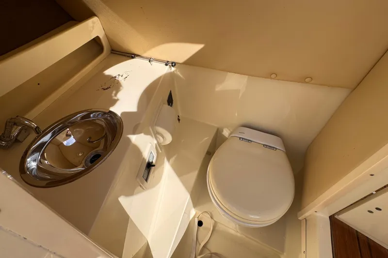  Yacht Photos Pics 2014 Chris-Craft Launch 28 boat bathroom with sink and toilet.