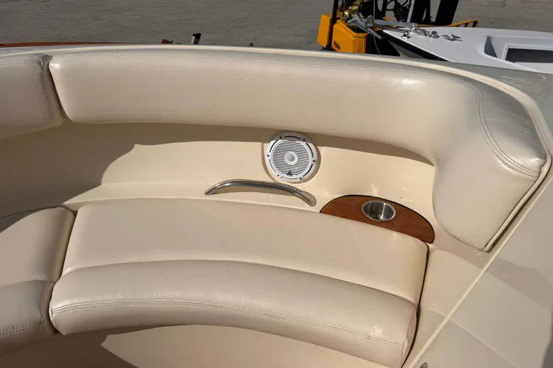  Yacht Photos Pics 2014 Chris-Craft Launch 28 boat interior with beige leather seating and speaker.