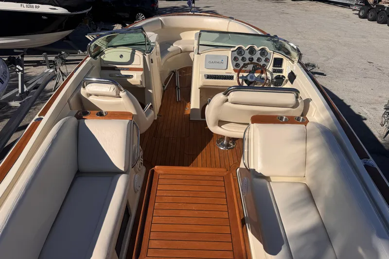  Yacht Photos Pics 2014 Chris-Craft Launch 28 boat interior with luxurious seating and wooden accents.