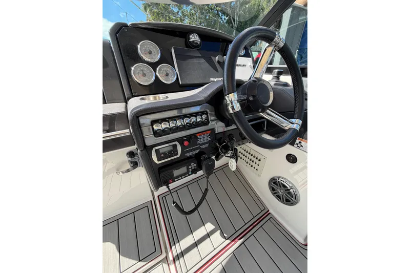  Yacht Photos Pics 2020 Formula 330 Crossover Bowrider OB dashboard with steering wheel and control panel.