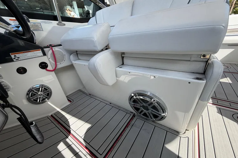  Yacht Photos Pics 2020 Formula 330 Crossover Bowrider OB interior with white seating and speaker system.