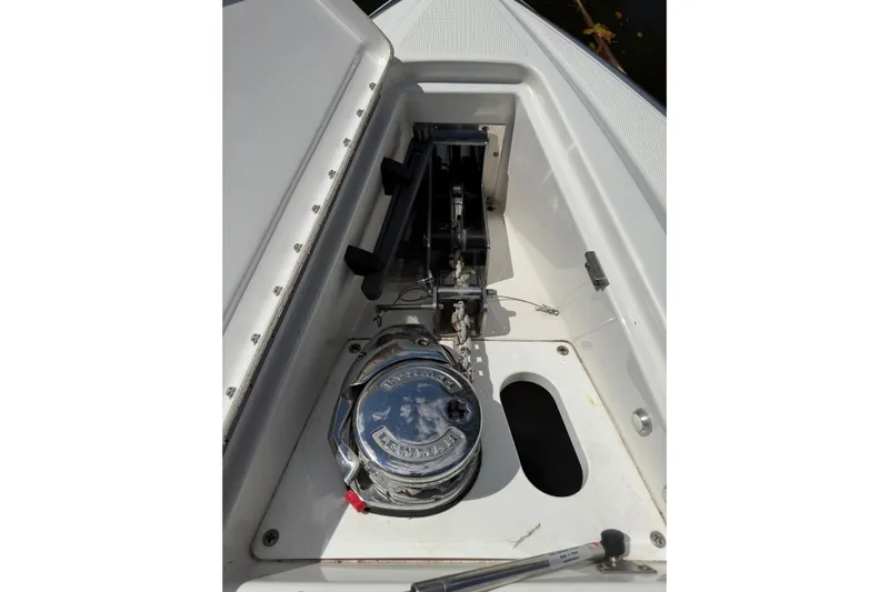  Yacht Photos Pics 2020 Formula 330 Crossover Bowrider OB anchor compartment with winch and chain mechanism.