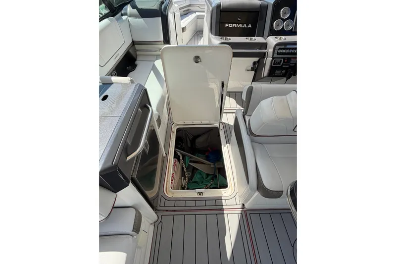 Yacht Photos Pics 2020 Formula 330 Crossover Bowrider OB interior with open storage compartment.