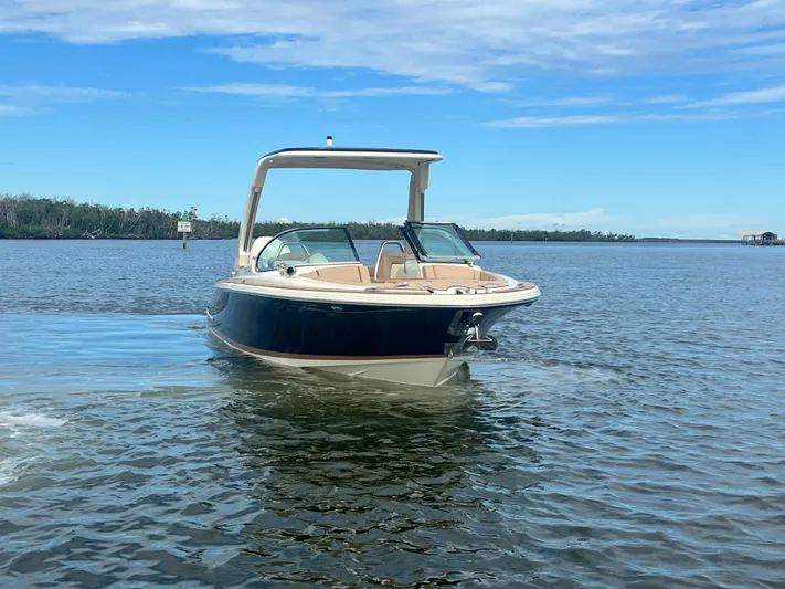  Yacht Photos Pics 2024 Chris-Craft Launch 25 GT boat on calm water under blue sky.