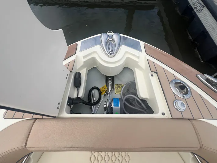 Yacht Photos Pics 2024 Chris-Craft Launch 25 GT bow storage compartment with anchor and rope.