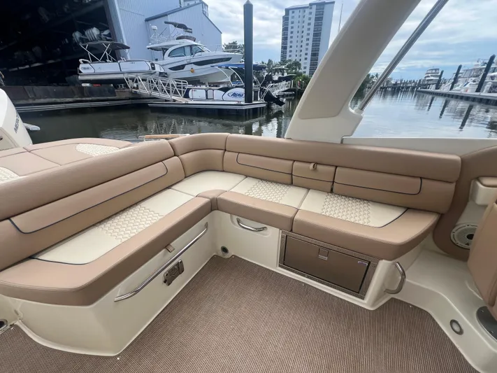  Yacht Photos Pics Luxurious interior of 2024 Chris-Craft Launch 25 GT boat with tan seating at marina.