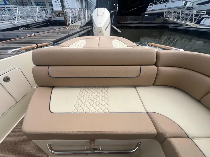  Yacht Photos Pics 2024 Chris-Craft Launch 25 GT boat interior with tan leather seating at dock.
