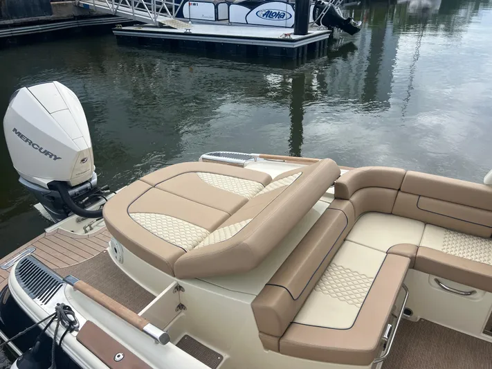  Yacht Photos Pics 2024 Chris-Craft Launch 25 GT boat with luxurious seating and Mercury outboard engine.