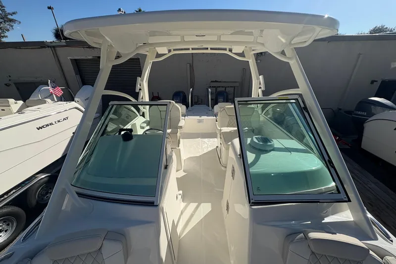  Yacht Photos Pics 2025 World Cat 230 DC boat with dual consoles and spacious seating.