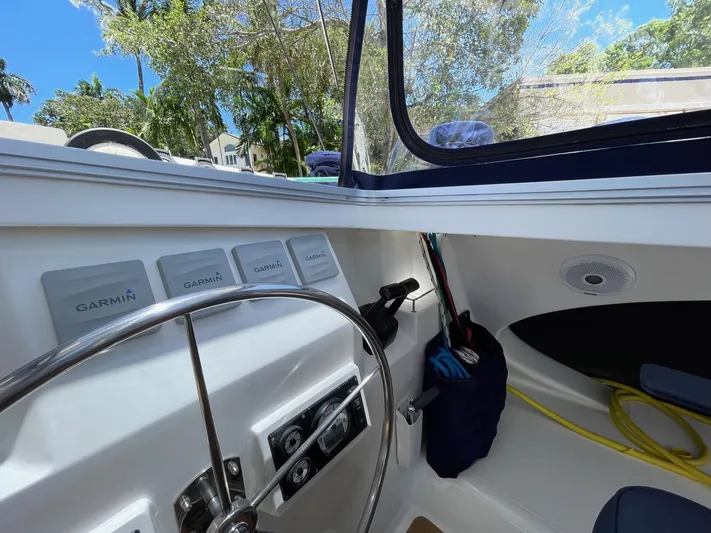  Yacht Photos Pics Interior of 2016 Knysna 500 SE with steering wheel and Garmin devices.