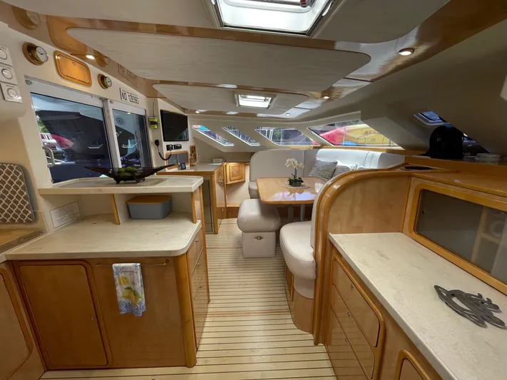  Yacht Photos Pics Interior of a 2016 Knysna 500 SE yacht with modern kitchen and dining area.