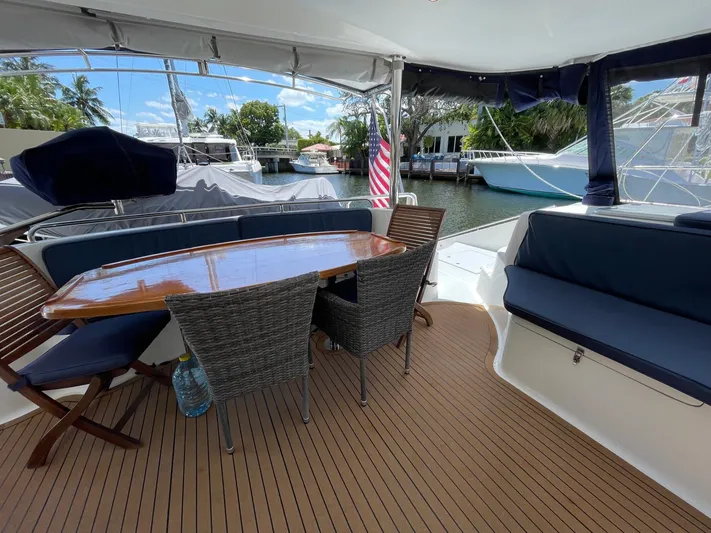  Yacht Photos Pics Deck area of a 2016 Knysna 500 SE yacht with table and chairs.