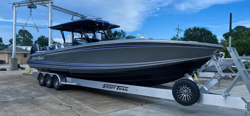  Yacht Photos Pics 2023 Nor-Tech 390 Sport Center Console boat on trailer, parked outdoors.